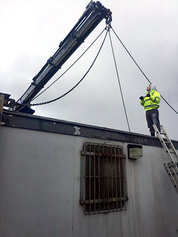 attaching cables to portacabin